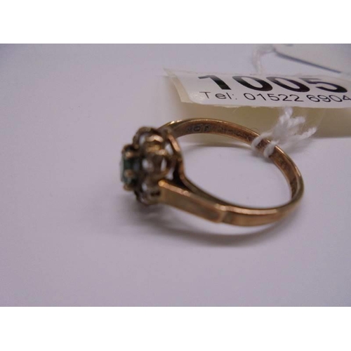 1005 - A yellow gold emerald and CZ ring, size O half, 2.8 grams.