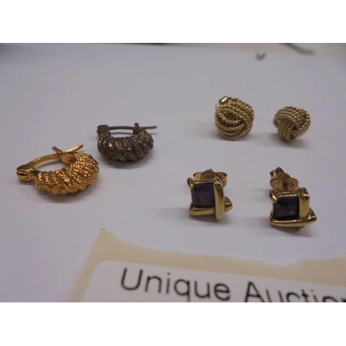 1013 - Two pairs of gold earrings (4 grams) and one other pair.