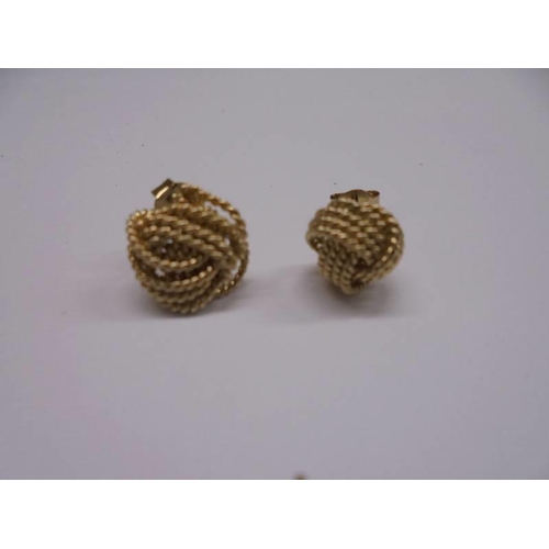 1013 - Two pairs of gold earrings (4 grams) and one other pair.