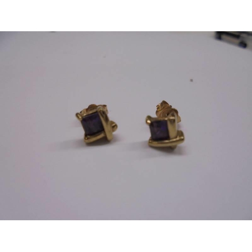 1013 - Two pairs of gold earrings (4 grams) and one other pair.