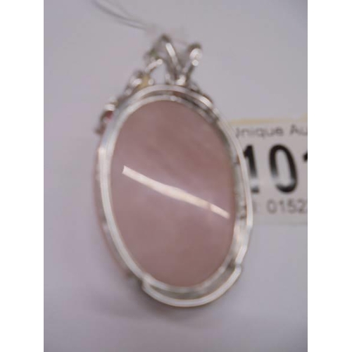 1014 - A silver and rose quartz pendant set coloured stones pendant.