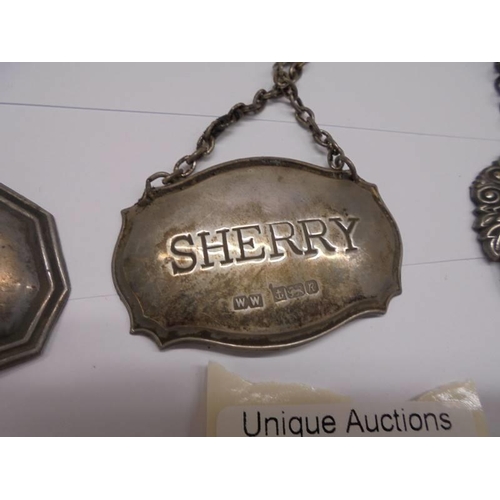 1030 - Three silver decanter labels, Brandy/Sherry/Port, 23 grams excluding chains.