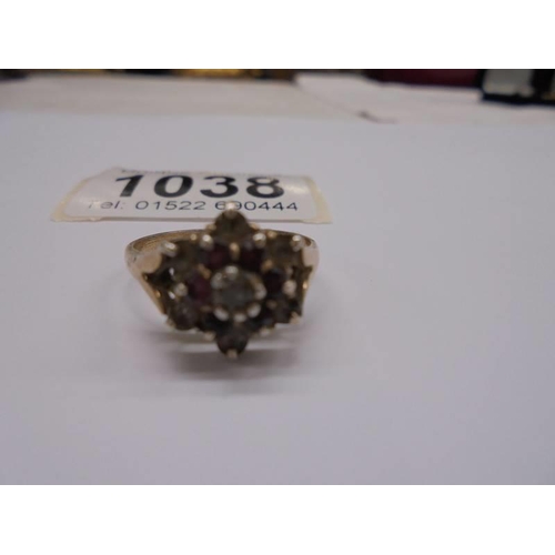 1038 - A 9ct gold cluster ring, size Q, 2.91 grams, (needs cleaning).