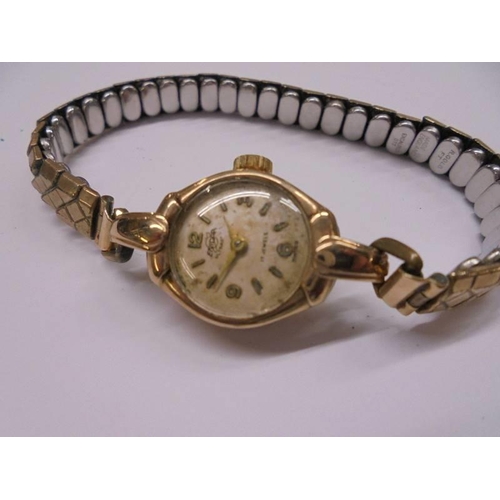 1053 - A 9ct gold Enidor Swiss 17 jewel ladies wrist watch on metal bracelet.