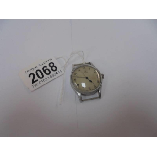 2068 - A military WW2 Omega wrist watch, (no strap) in working order.