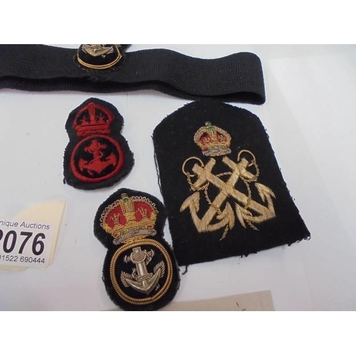 2076 - Hooks and cap badges supposedly belonging to Brian Gandy, 2 years service, 1952-1954 or 1953-1955.