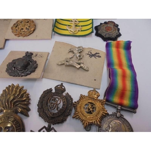 2079 - A 1914-1918 medal for 3262 Pte H Pearson Lanc. Fusiliers and a selection of cap & pin badges includi... 