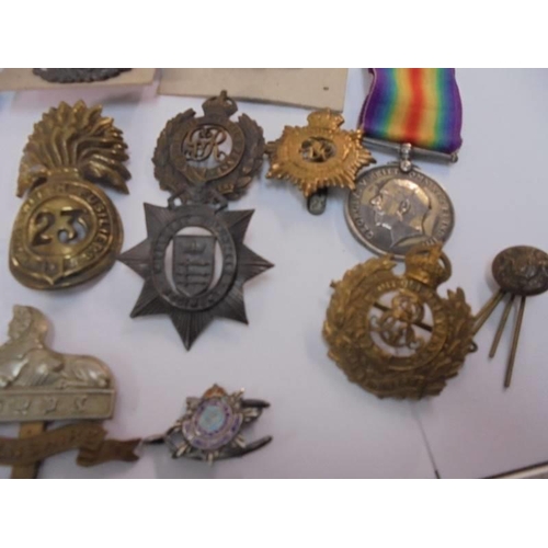 2079 - A 1914-1918 medal for 3262 Pte H Pearson Lanc. Fusiliers and a selection of cap & pin badges includi... 