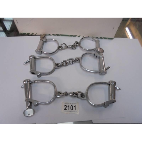 2101 - Three sets of hand cuffs with keys.