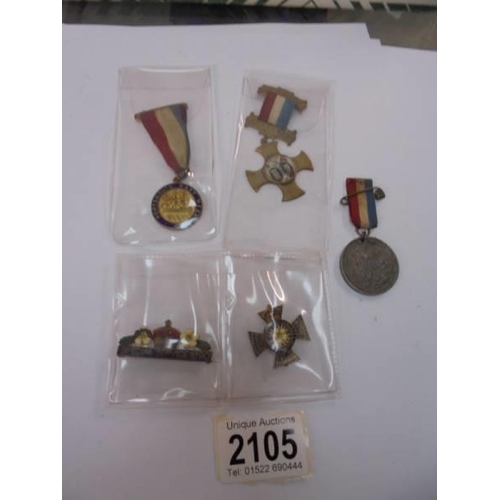 2105 - A Portsmouth Navy week medal, a European war souvenir medal, a Victorian medal and yellow flowers Pr... 