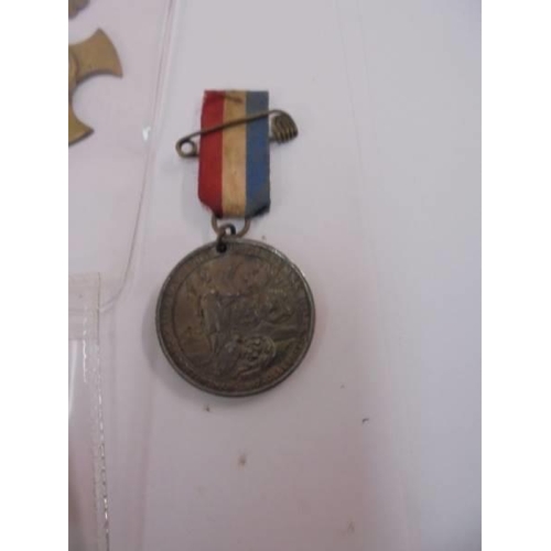 2105 - A Portsmouth Navy week medal, a European war souvenir medal, a Victorian medal and yellow flowers Pr... 