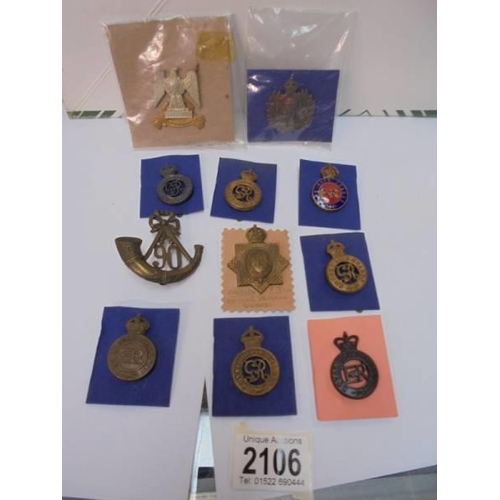 2106 - A mixed lot of badges including the Horse Guards, The Life Guards, 1st Kings Dragoons etc.,