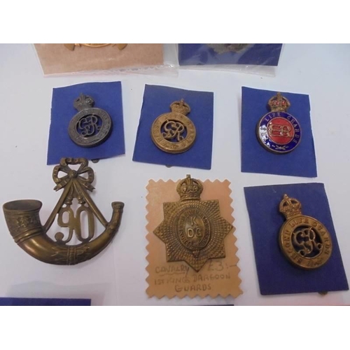 2106 - A mixed lot of badges including the Horse Guards, The Life Guards, 1st Kings Dragoons etc.,