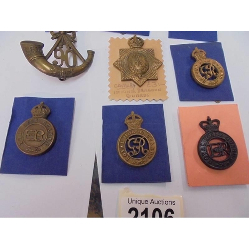 2106 - A mixed lot of badges including the Horse Guards, The Life Guards, 1st Kings Dragoons etc.,