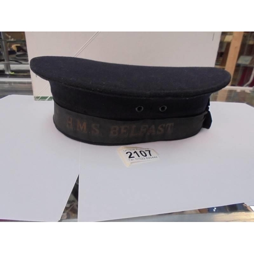 2107 - A Royal Navy HMS Belfast seaman's cap.