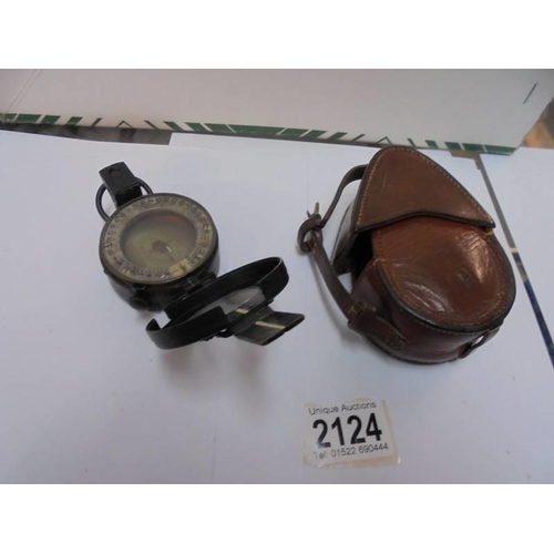 2124 - A leather cased military compass.