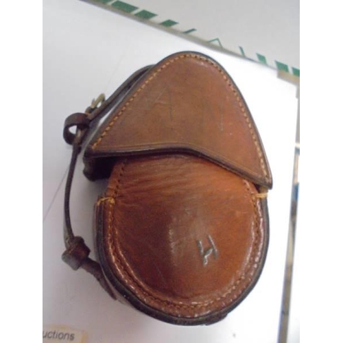 2124 - A leather cased military compass.