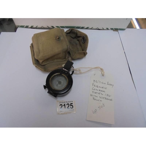 2125 - A British army prismatic compass dated 1941 with webbing pouch.