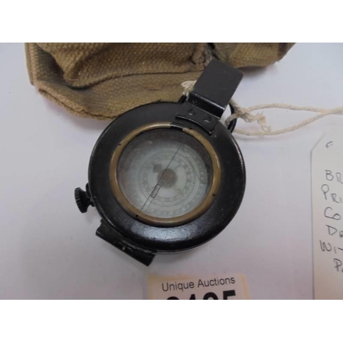 2125 - A British army prismatic compass dated 1941 with webbing pouch.