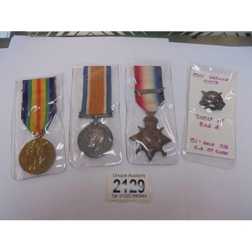 2129 - Three WW1 medals and an army service corps badge No. 845A - M1-6166 Pte C S McGuire.