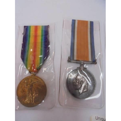 2129 - Three WW1 medals and an army service corps badge No. 845A - M1-6166 Pte C S McGuire.