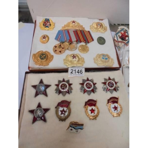 2146 - A collection of replica Russian medals and badges.