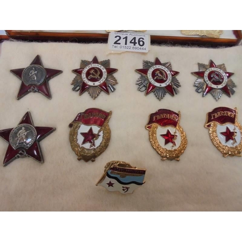 2146 - A collection of replica Russian medals and badges.