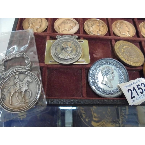 2153 - A case containing eleven Napoleon Empire coins together with other Napoleon related coins.