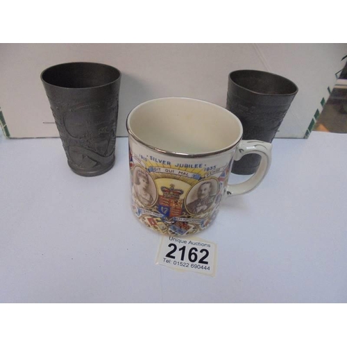 2162 - A Metal Edward VII coronation beaker, a metal German beaker and a 1935 silver jubilee mug.