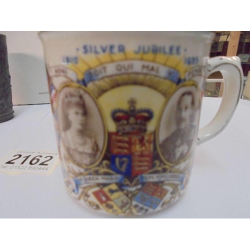 2162 - A Metal Edward VII coronation beaker, a metal German beaker and a 1935 silver jubilee mug.