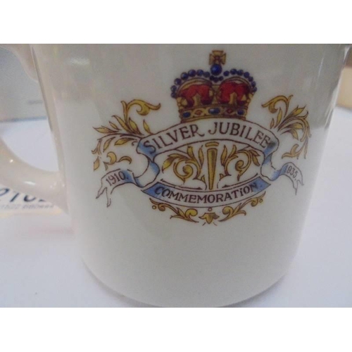 2162 - A Metal Edward VII coronation beaker, a metal German beaker and a 1935 silver jubilee mug.