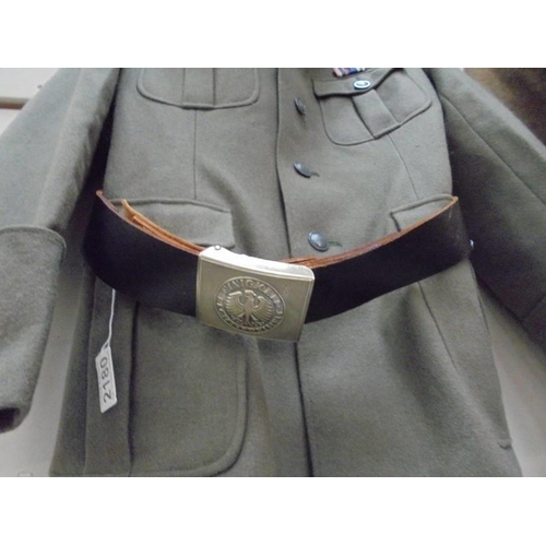 2180 - An East German officer uniform comprising trousers/jodphurs waist 34, custom tunic (large or medium)... 