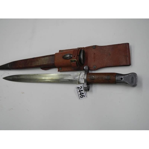 2446 - A Wilkinson bayonet in leather scabbard, blade 30.5cm.