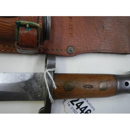 2446 - A Wilkinson bayonet in leather scabbard, blade 30.5cm.