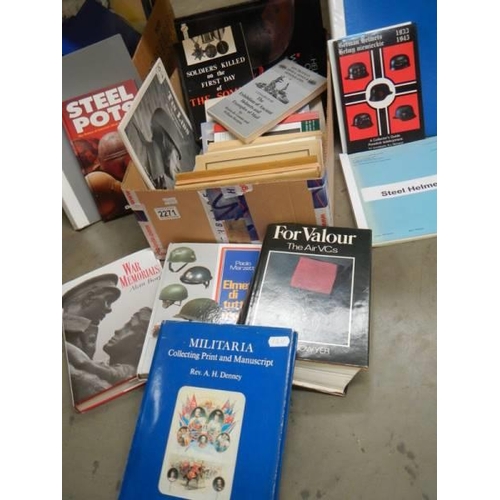 2271 - A box of military books relating to helmets, medals, uniforms etc,,