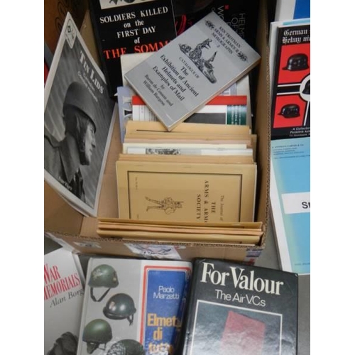 2271 - A box of military books relating to helmets, medals, uniforms etc,,