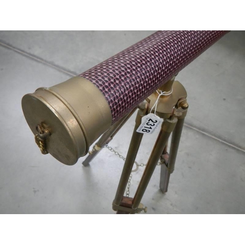 2318 - A reproduction brass telescope on tripod.