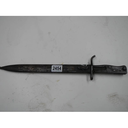 2454 - An all steel bayonet with scabbard.