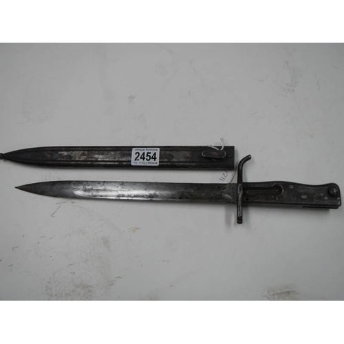 2454 - An all steel bayonet with scabbard.