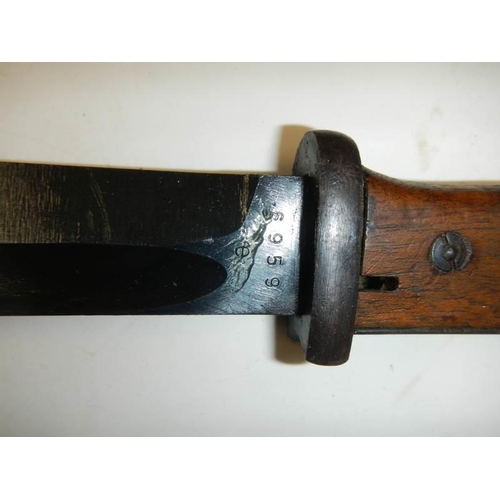 2455 - A K98 bayonet stamped COF44, serial No. 6959 with scabbard and frog.