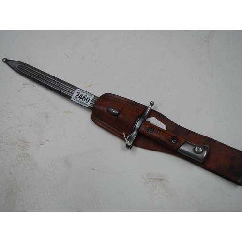 2460 - A bayonet stamped E8993 with scabbard and leather frog, blade 29.5 cm.