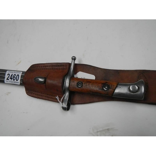 2460 - A bayonet stamped E8993 with scabbard and leather frog, blade 29.5 cm.