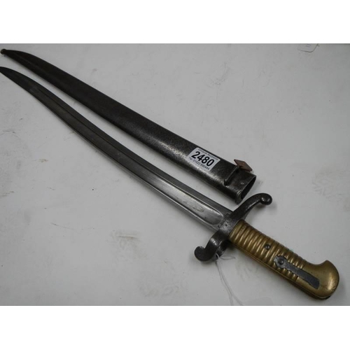 2480 - A French Chassepot bayonet with scabbard No.548, inscribed on edge and dated 1814-1942.