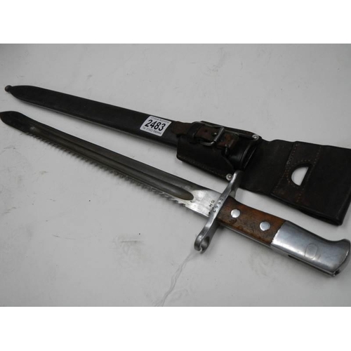 2483 - A saw back bayonet stamped HS serial No. 79933 with scabbard, blade 48 cm.