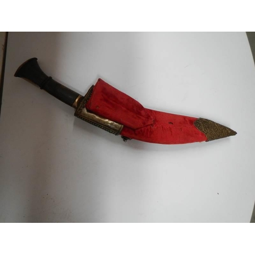 2555 - A vintage kukri with stone encrusted gilded red velvet scabbard.