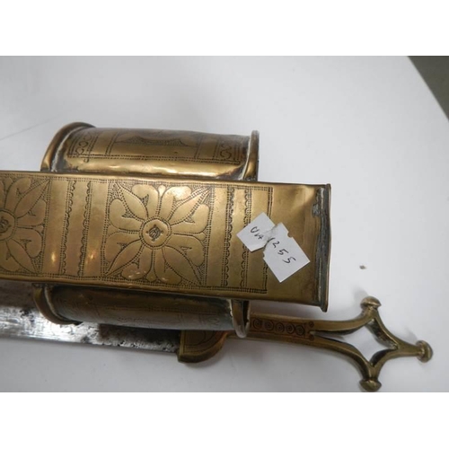 2557 - A North African assassins blace with brass handle and scabbard with bracelet, COLLECT ONLY.