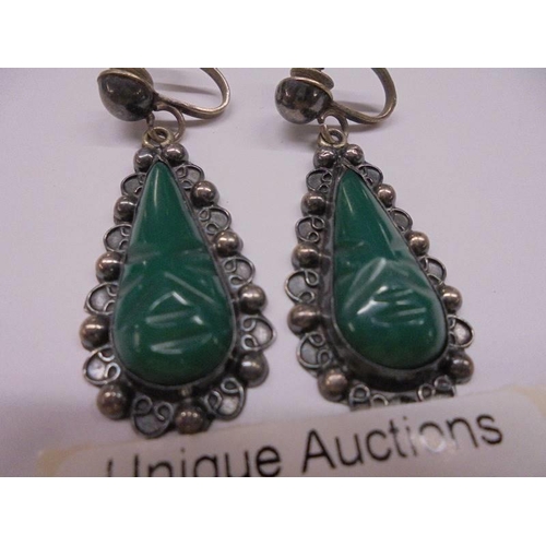 1064 - A pair of silver and jade pendant earrings.