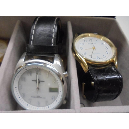 1074 - A case containing eight gents watches including Sekonda, Precision etc.,