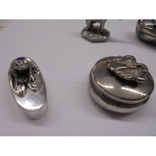 1080 - A silver pill box with elephant atop and a collection of silver plate pill boxes.