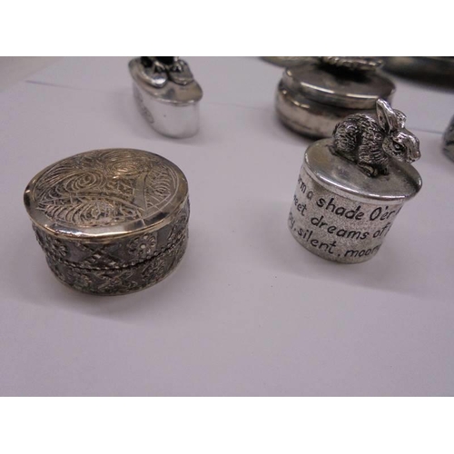 1080 - A silver pill box with elephant atop and a collection of silver plate pill boxes.